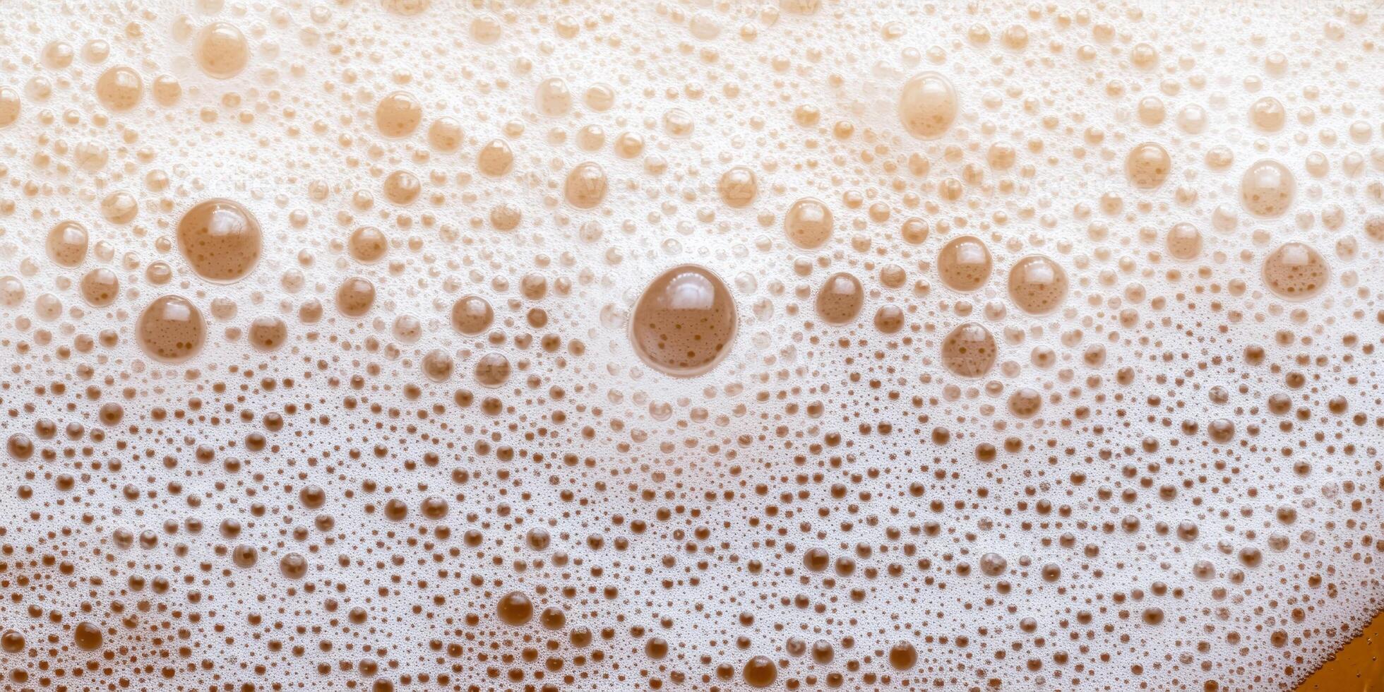 Close-up of frothy foam bubbles on coffee beverage surface photo