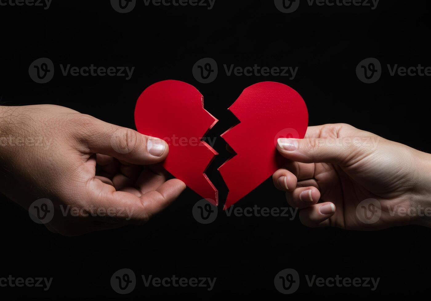 Holding Broken Heart Halves Representing Relationship Breakup and Emotional Pain photo