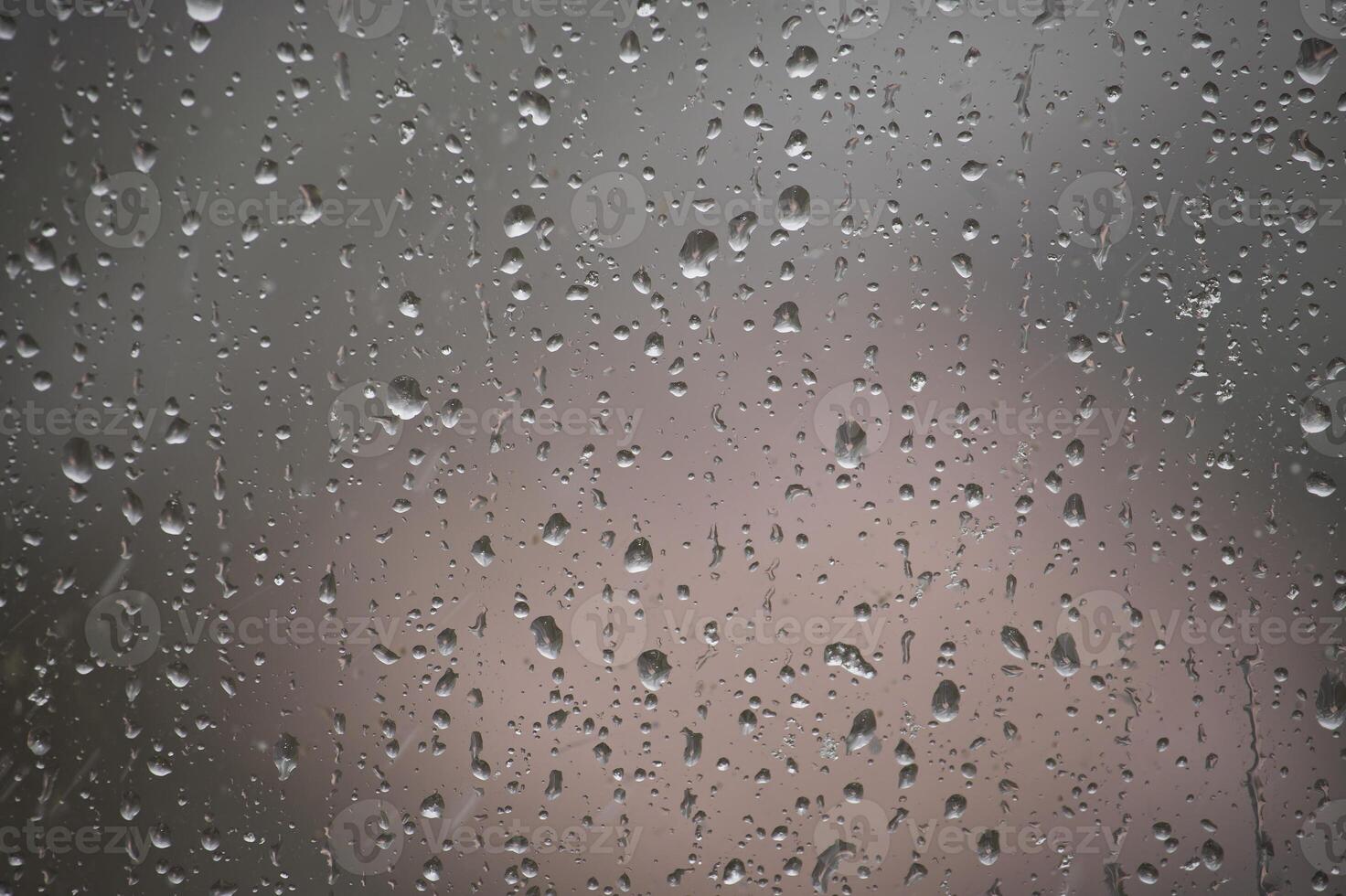 Raindrops on Window With Blurry Overcast Background photo