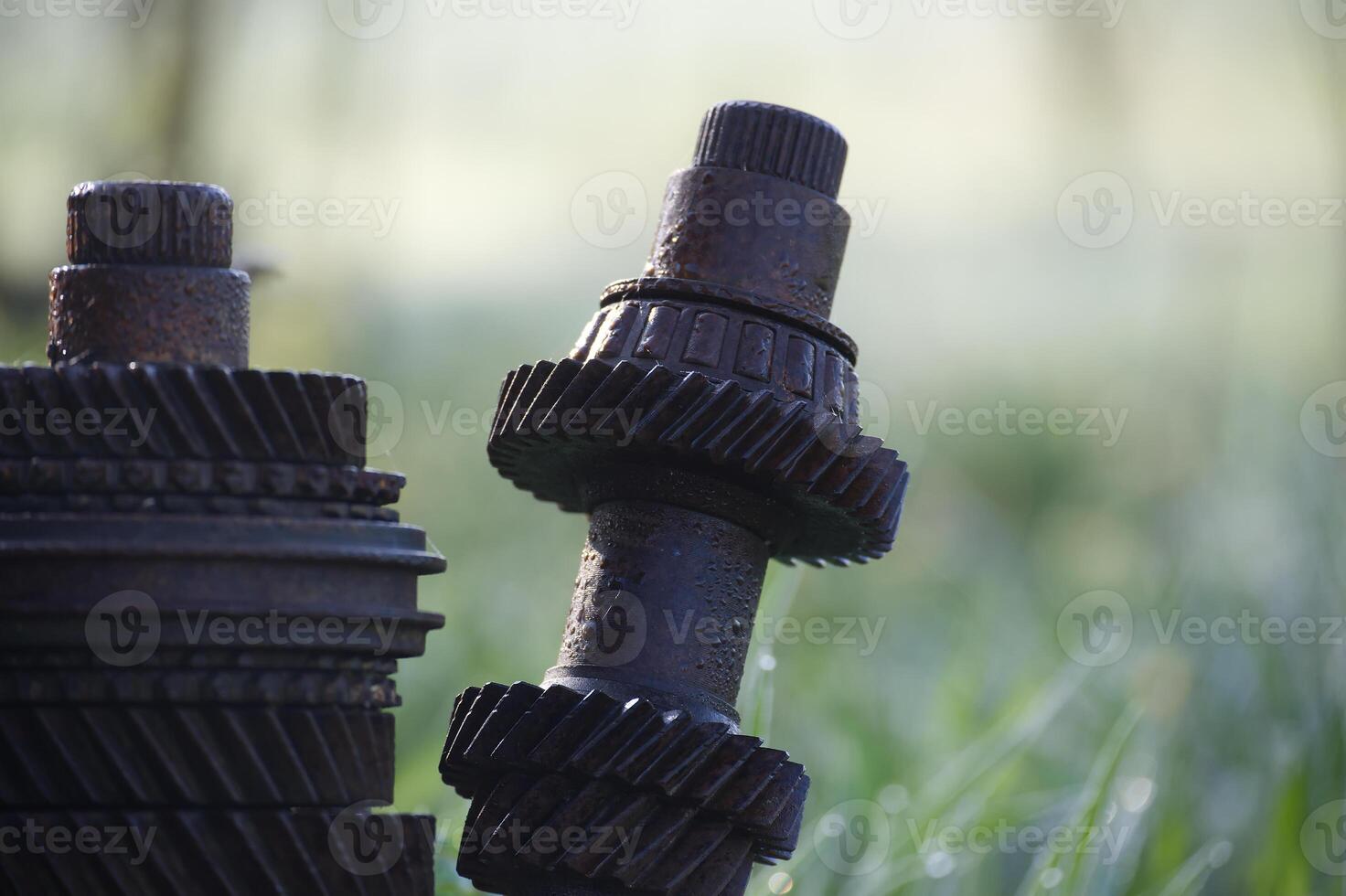 Rusty gears and shafts creating an interesting outdoor sculpture photo