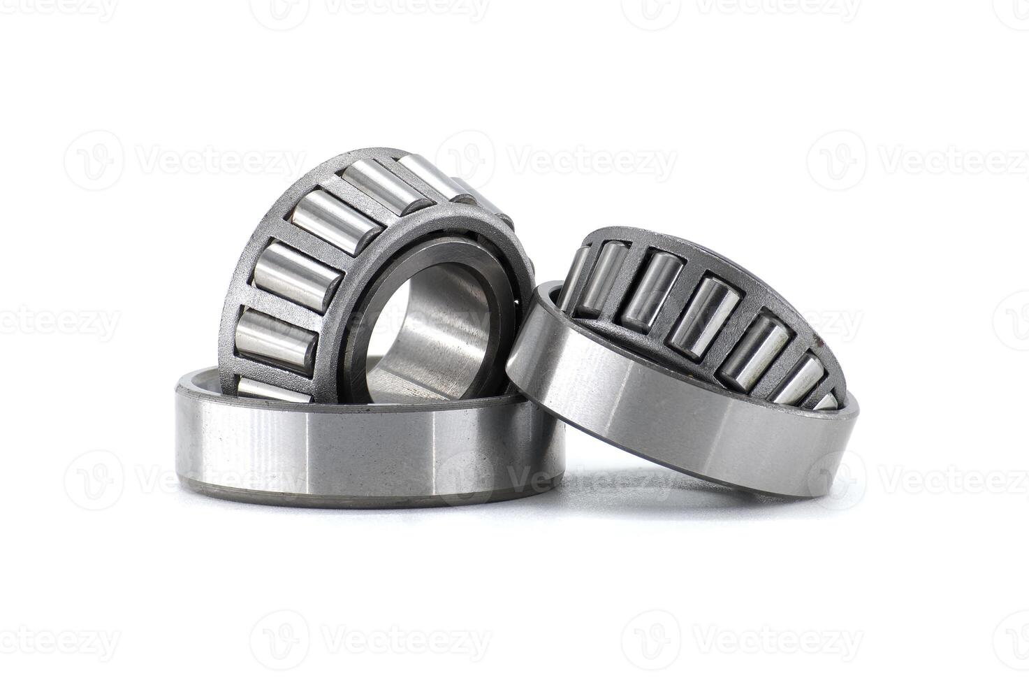Detailed shot of three tapered roller bearings, ideal for mechanical and industrial applications. photo