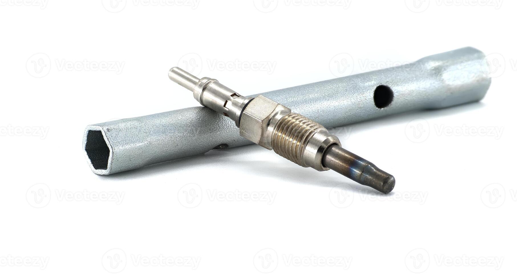 Diesel Engine Glow Plug with Socket Tool on White Background photo