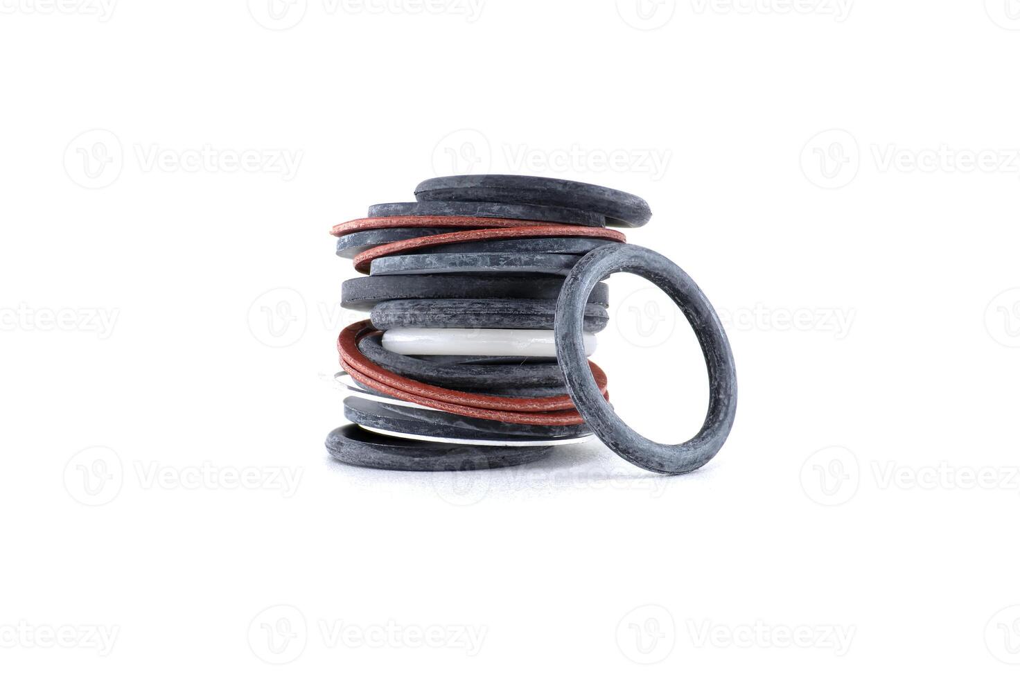 A detailed shot of a stack of assorted o-rings, showcasing mechanical parts and components. photo