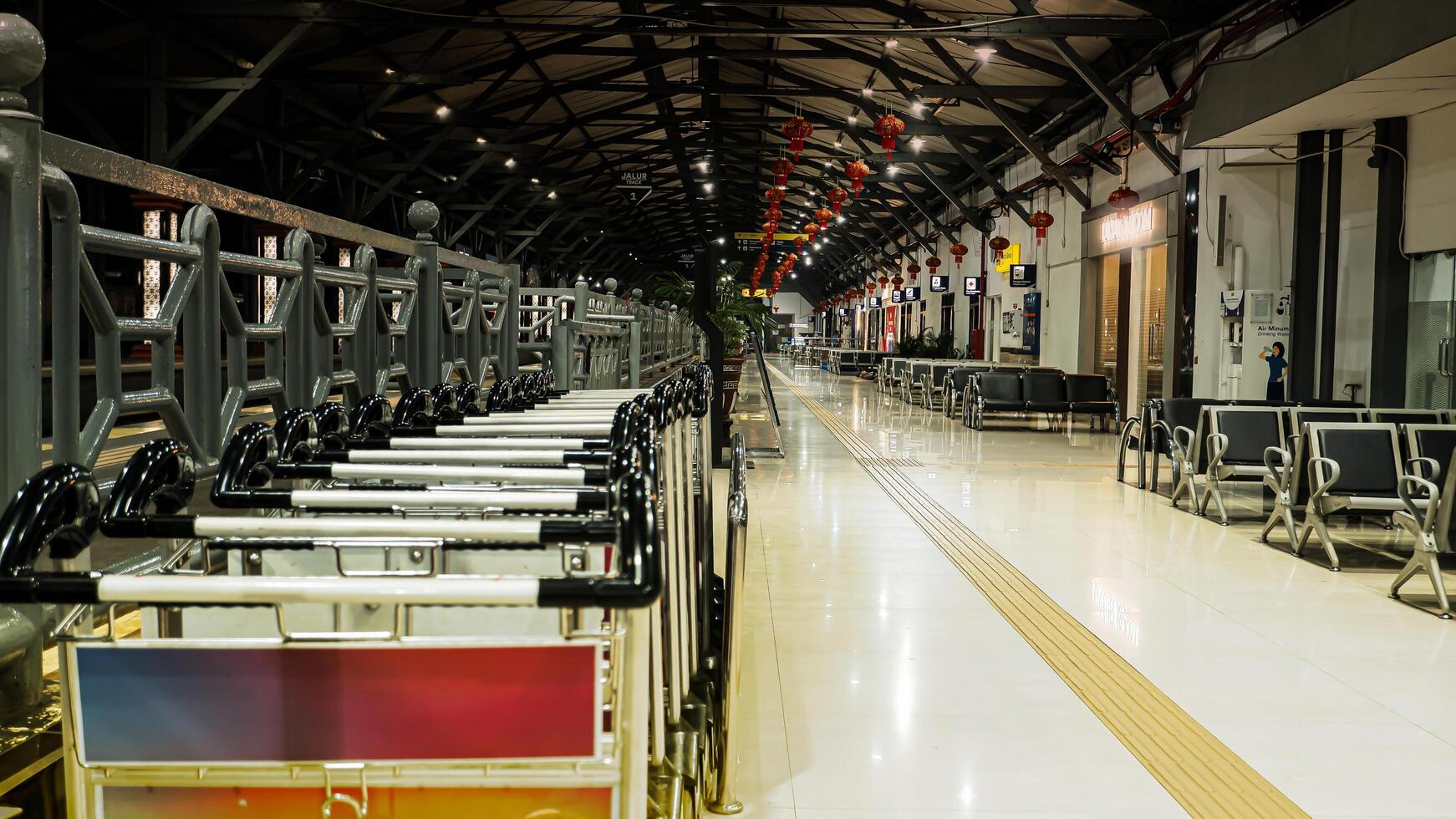 Surabaya train station, Indonesia, February 09, 2024. chairs lined up neatly at a train station. passenger seats. photo