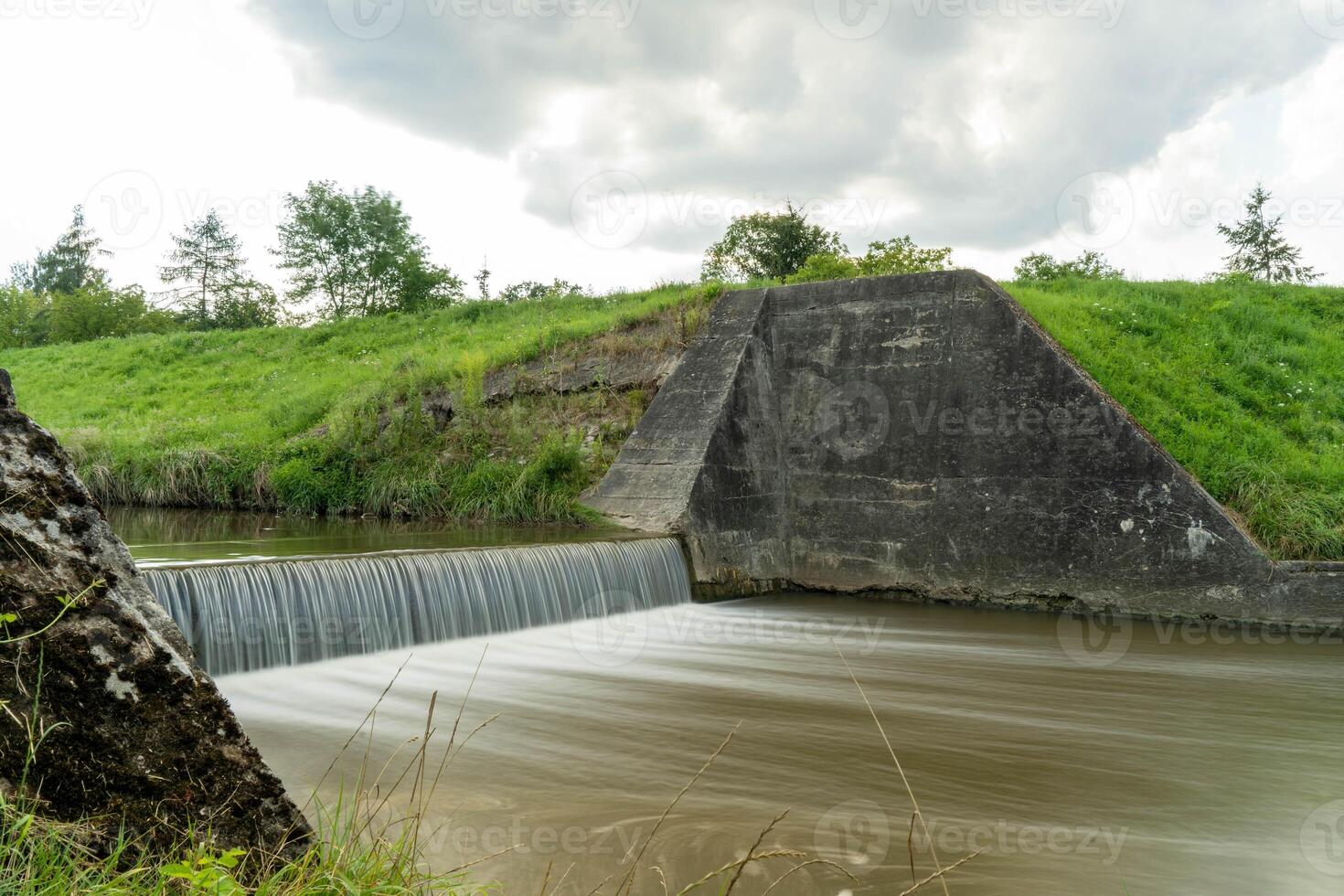 Small Concrete Spillway with Flowing Water photo