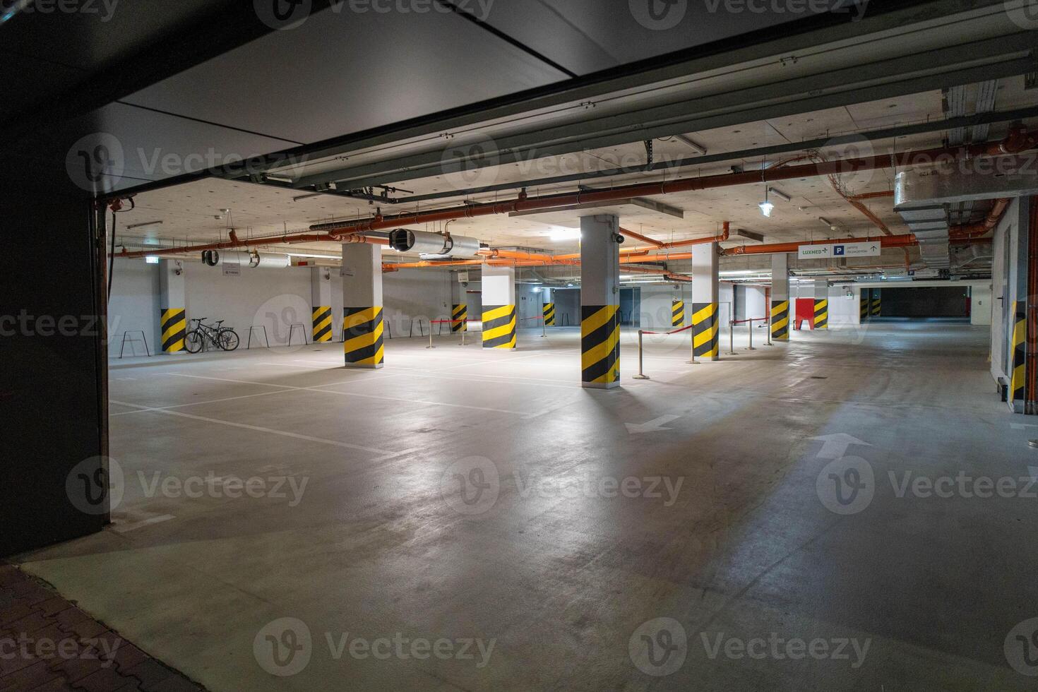 Underground Parking Lot with Concrete Flooring and Column Design photo
