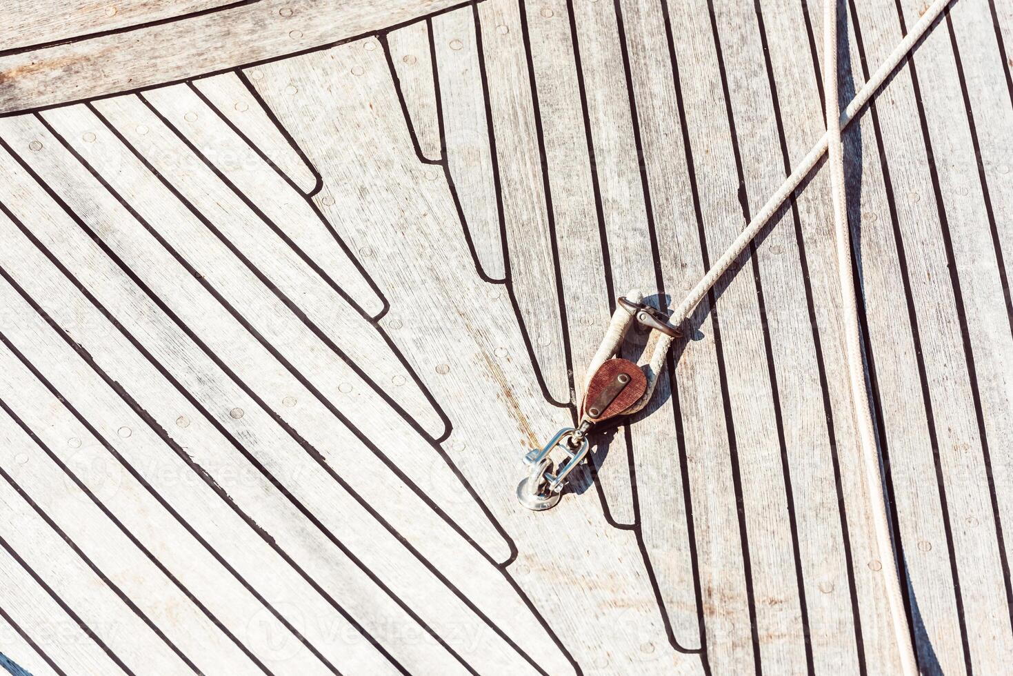 Boat deck with wooden texture and rope detail, abstract pattern background photo