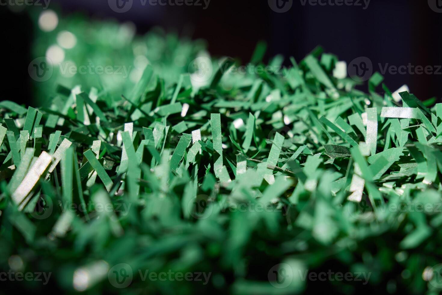 Vibrant and EyeCatching Green Shredded Paper Ideal for Various Crafts and Decorations Projects photo
