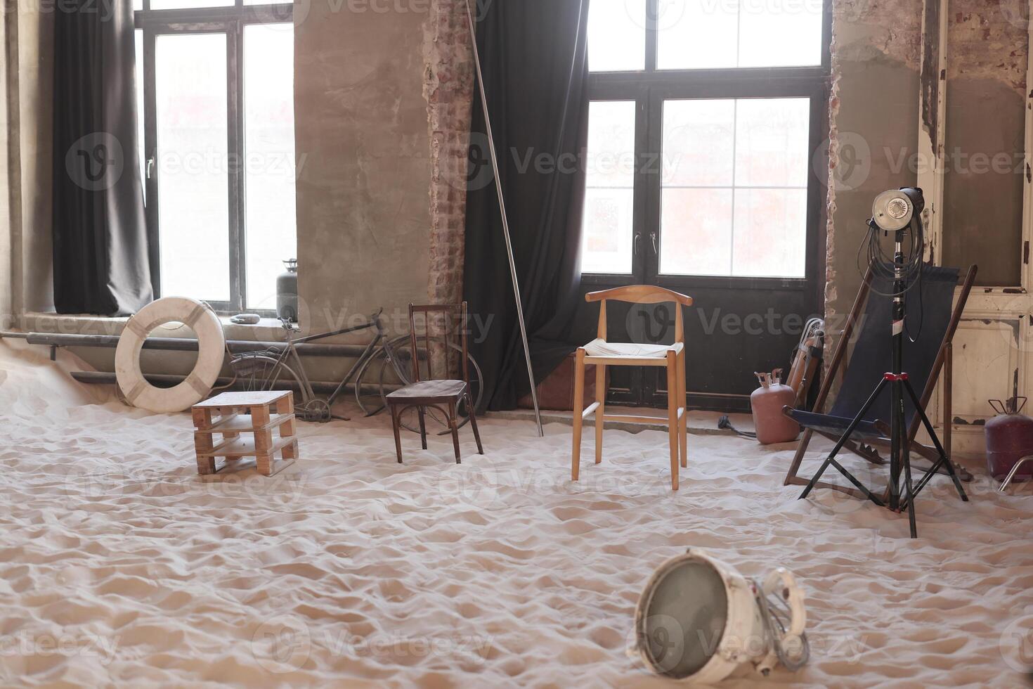 An Artistic Space Featuring Chairs on a Sandy Floor with inspiring Minimalist Design Elements photo