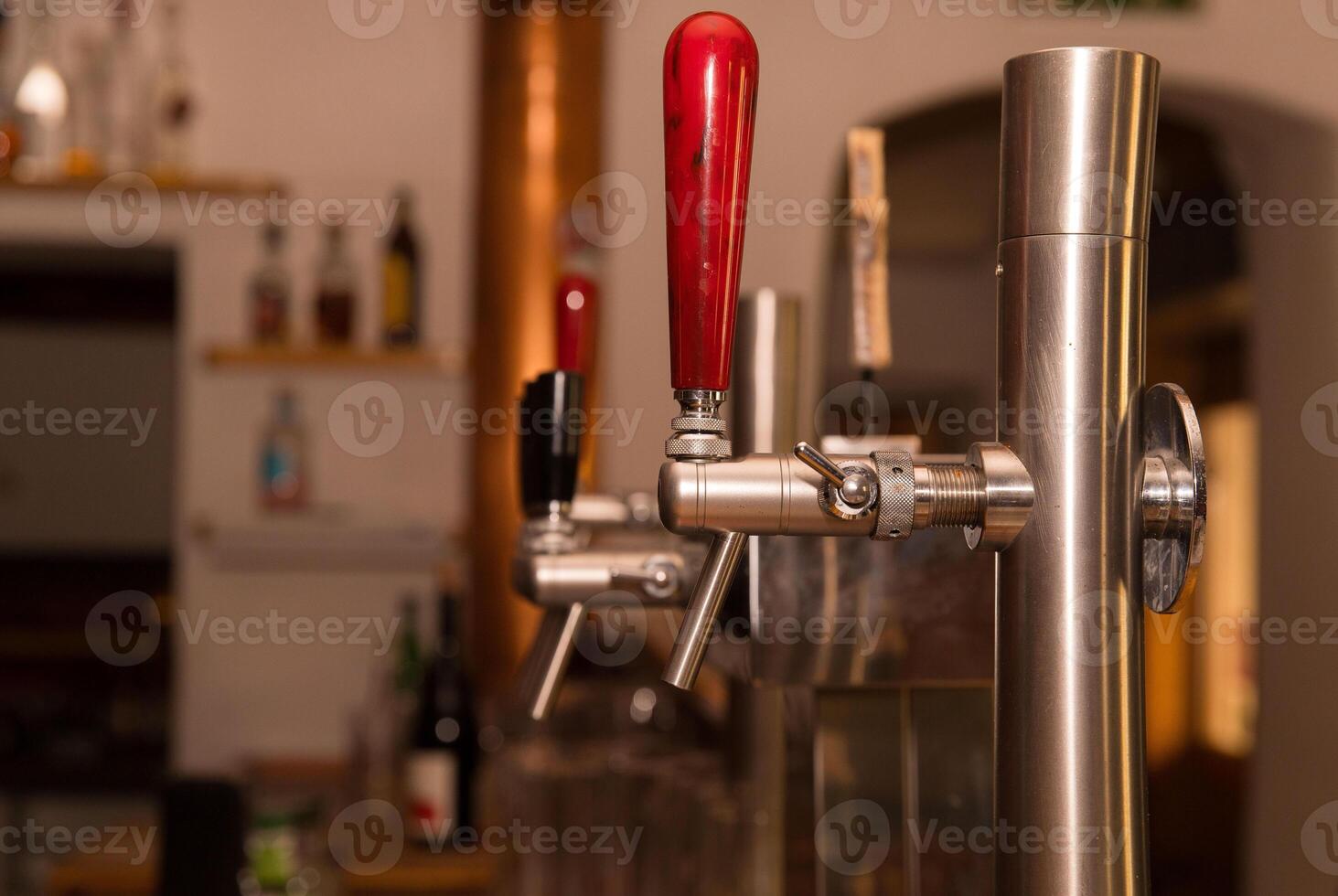 Close-up of beer tap handles at a cozy bar setting photo