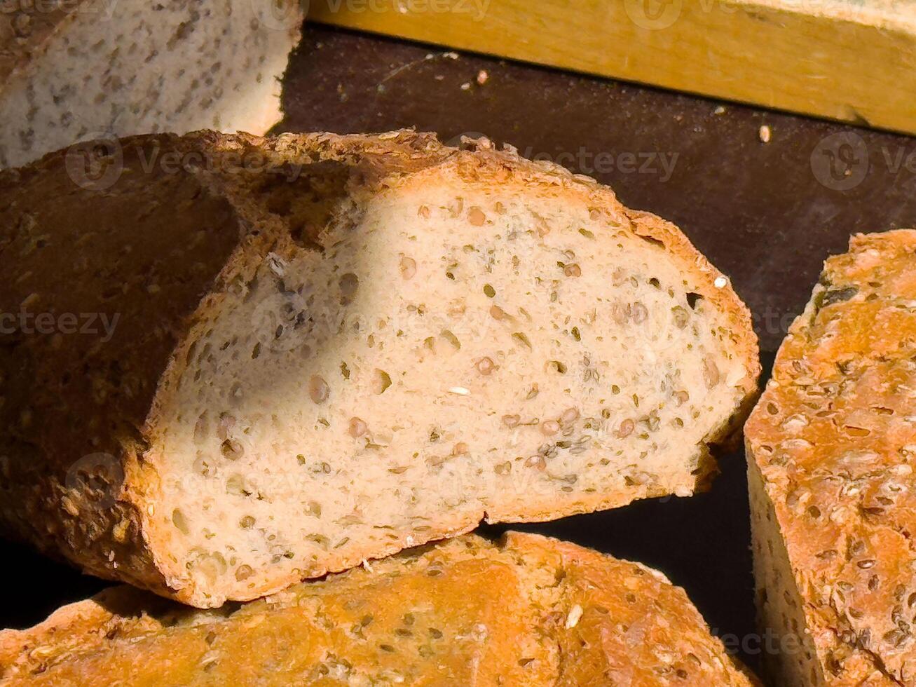 Sliced multigrain bread with seeds in sunlight photo
