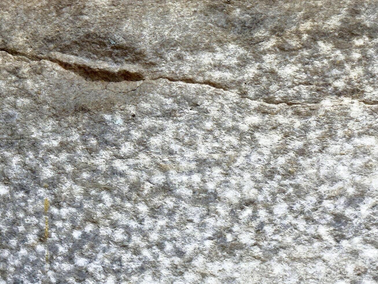Rough granite texture with natural patterns and cracks photo