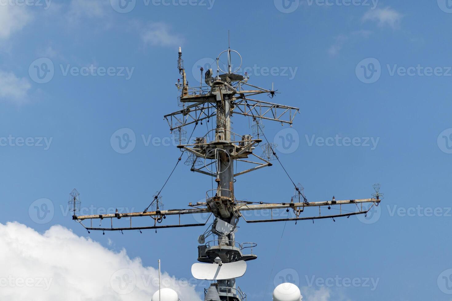 The mast of a large yacht with navigation equipment bottom view photo