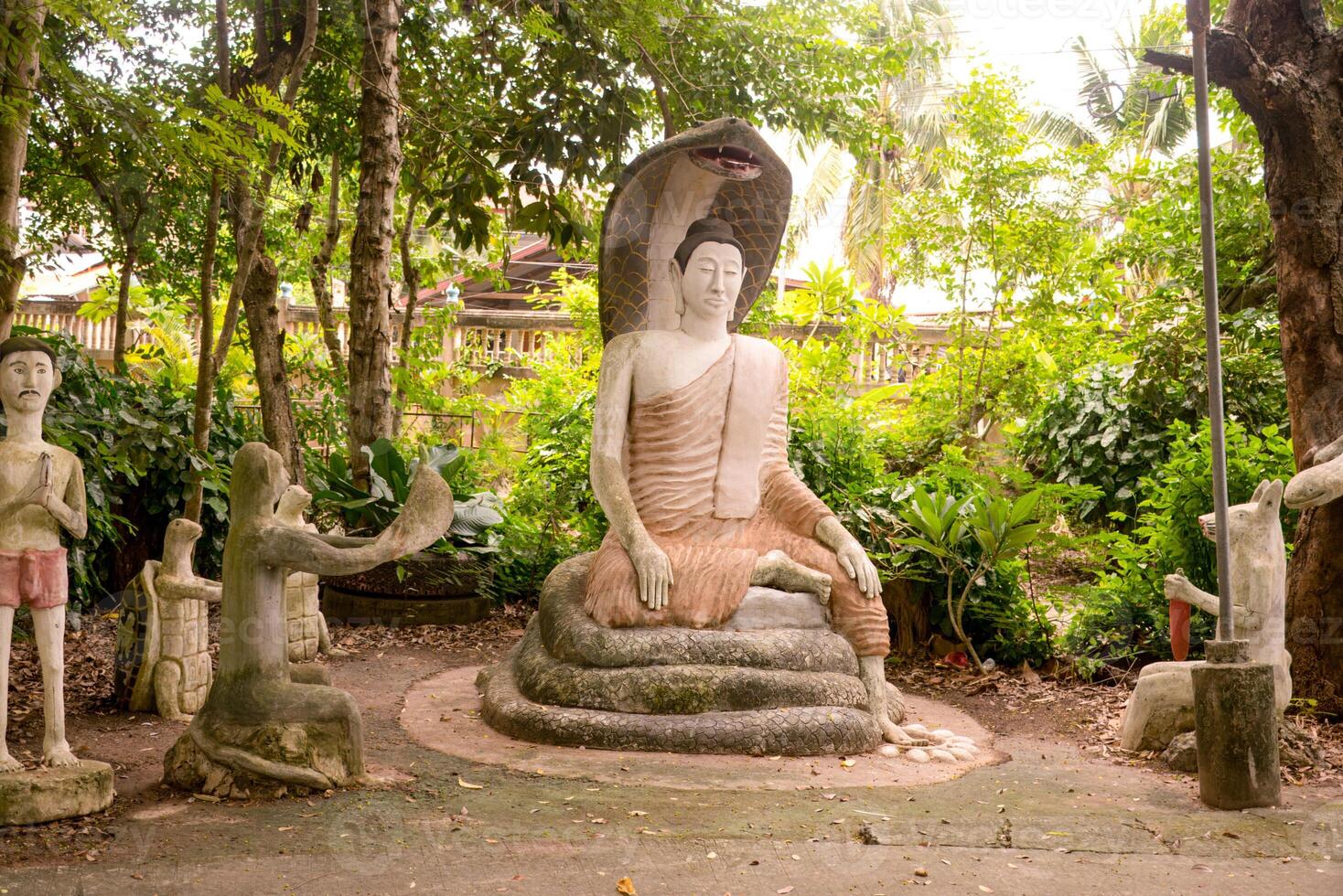 Buddha Statue Under Naga Hood photo