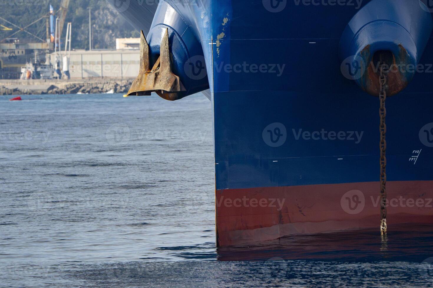 big ship with anchors prow detail outside the harbor photo