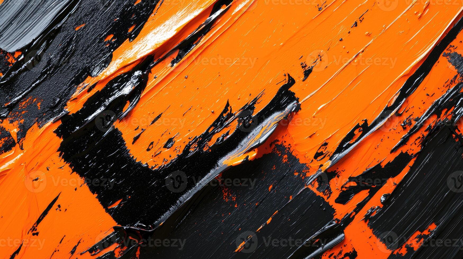 A close up of a painting with orange and black paint photo