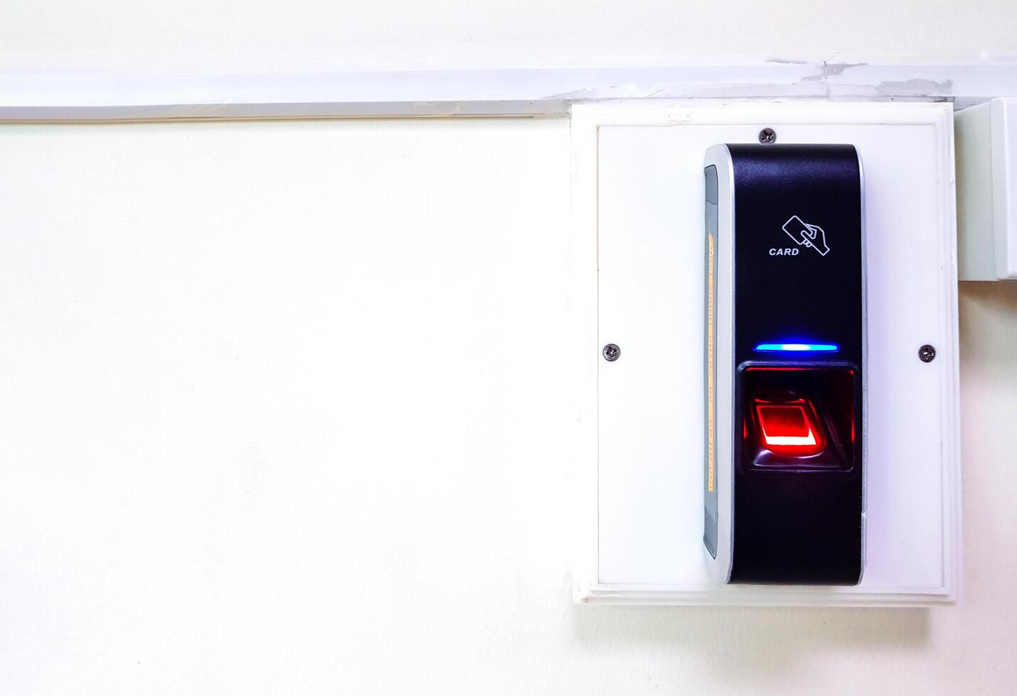 Black finger scanner device on white background for secure, access or entrance to area strict with copy space. Electronic and security equipment. photo