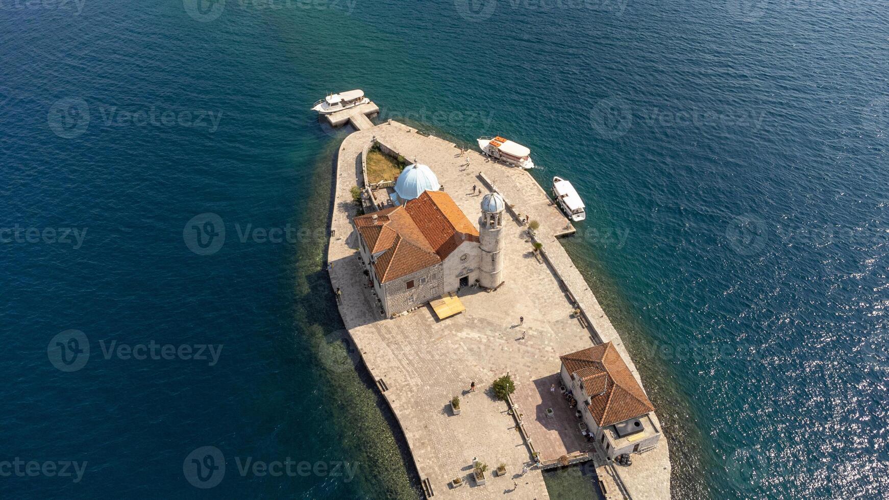 Top view of the island near Perast of the church of our lady of the rocks. Aerial landscape of tourist attraction in the Bay of Kotor, Montenegro photo