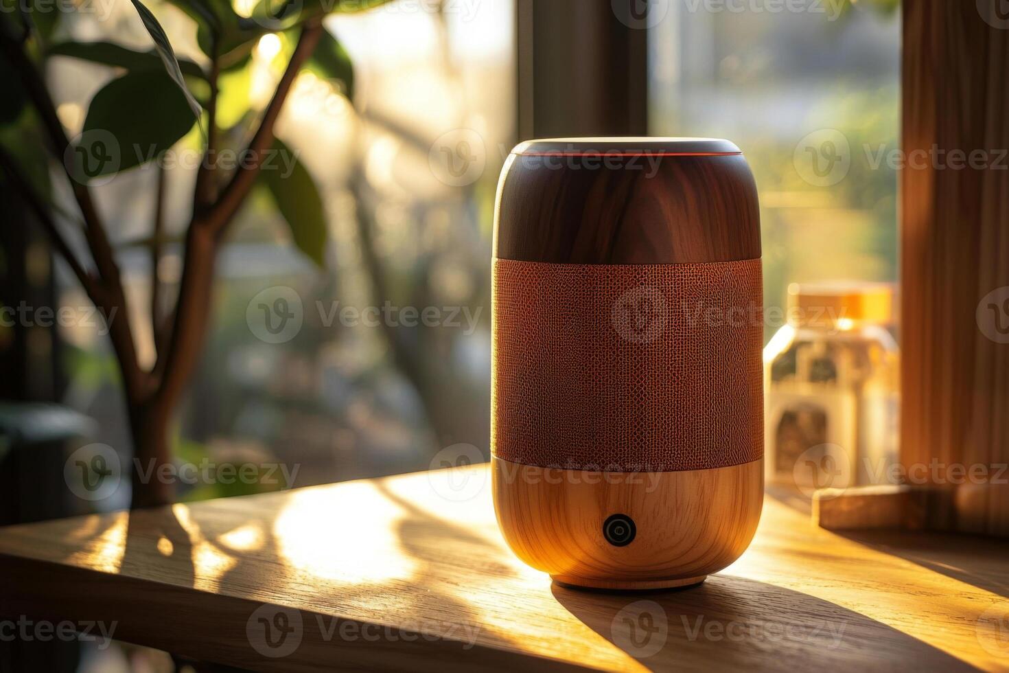 Wireless bluetooth speaker on wooden table with morning sunlight photo