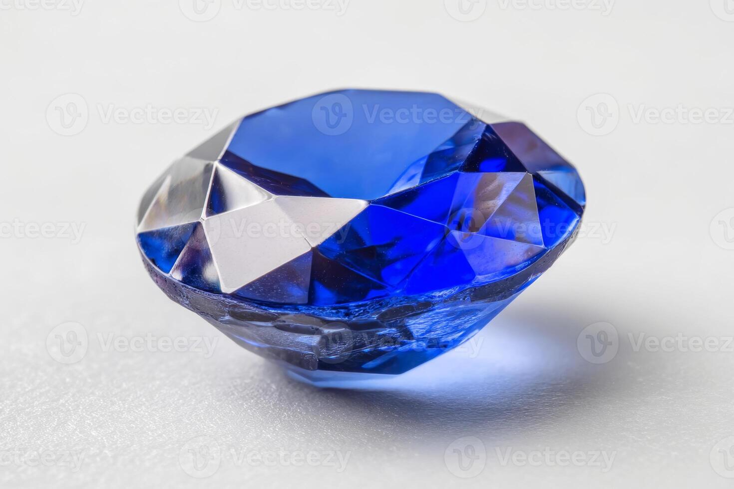 Blue sapphire gemstone on white background photo