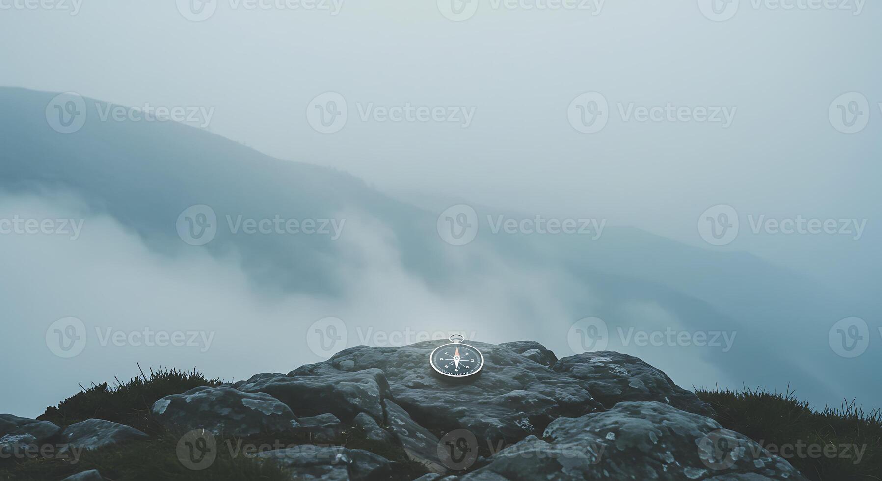 A Compass on a Misty Mountaintop. Guiding Your Journey Through Uncharted Territories photo