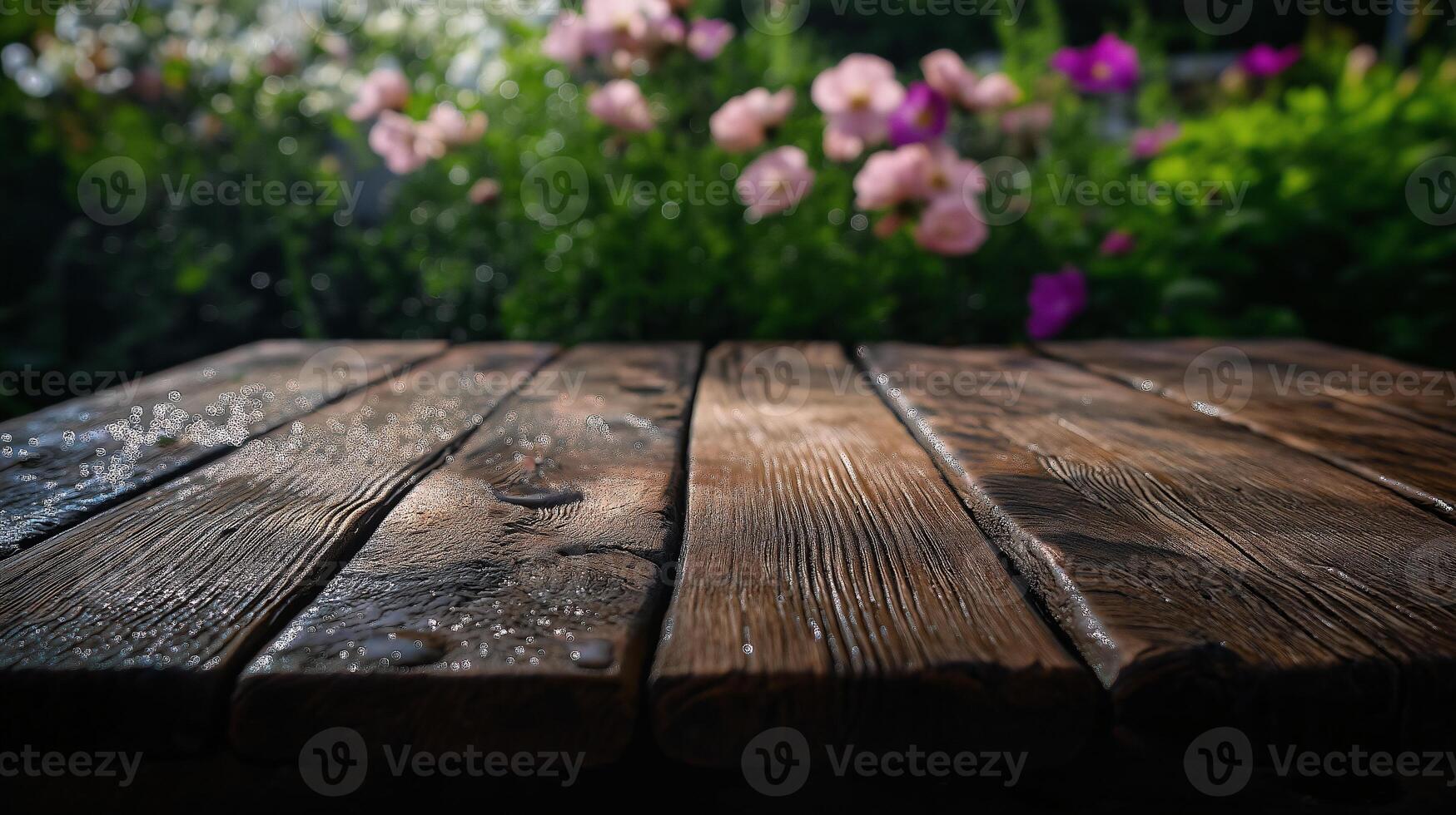 A wooden table with flowers in the background photo