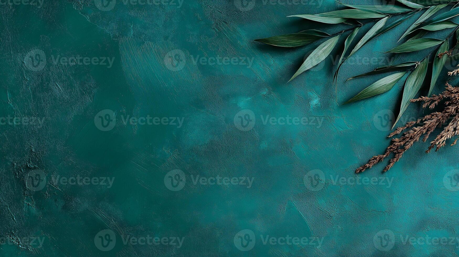 Green leaves and branches on a blue background photo