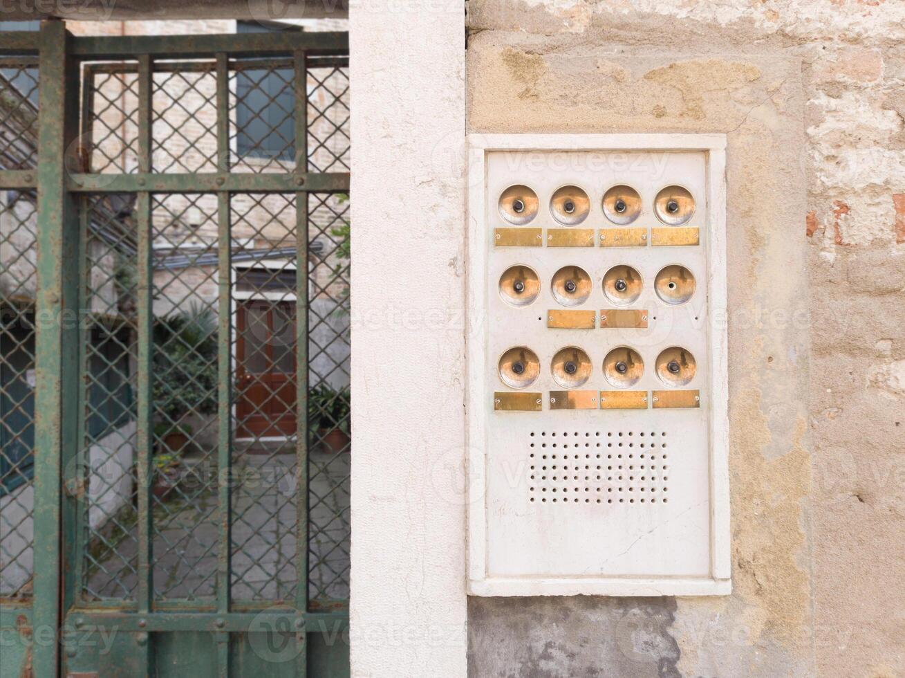 Old Apartment Intercom with Brass Buttons photo