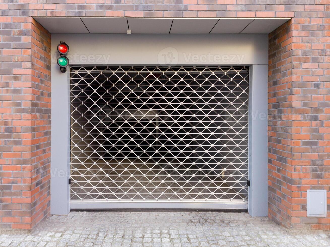 Modern metal security gate at parking entrance photo