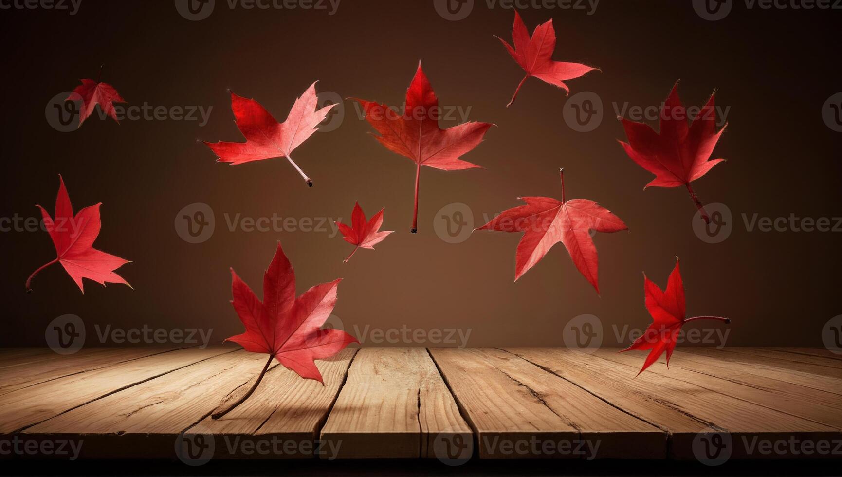 Red Autumn Leaves Floating Above Wooden Table photo