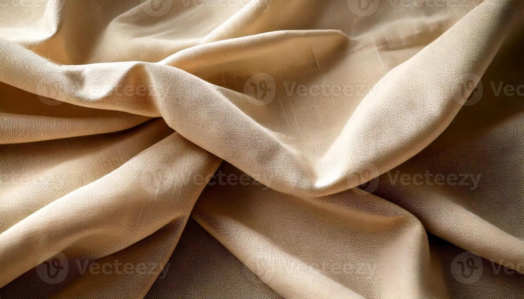 Close-up of beige linen fabric with soft folds and gentle shadows photo