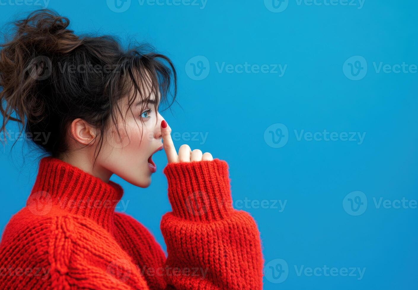 Stunning Woman in Red Knitwear Against Vibrant Blue Background A Captivating Fashion Portrait photo