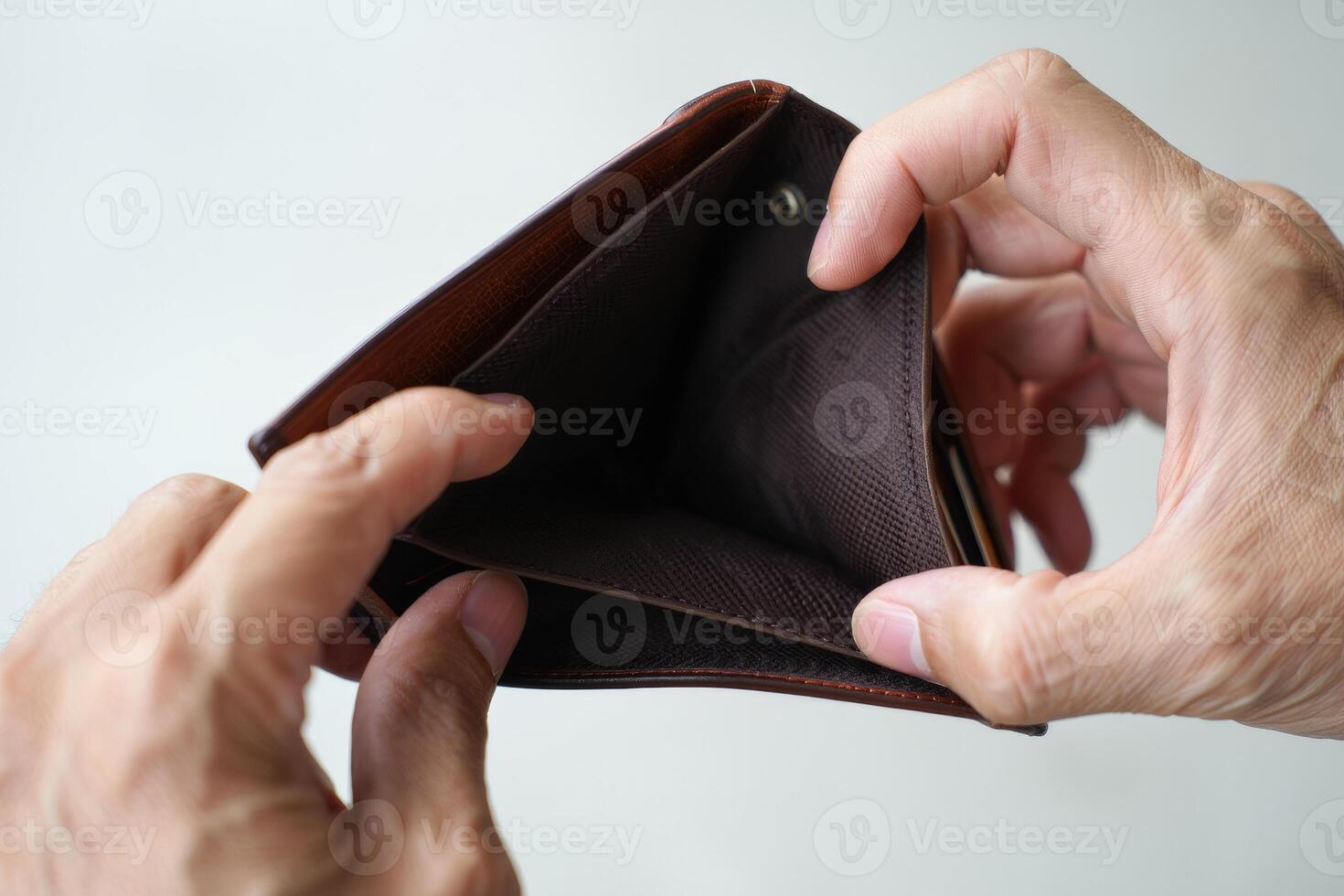 A person holding an empty wallet photo