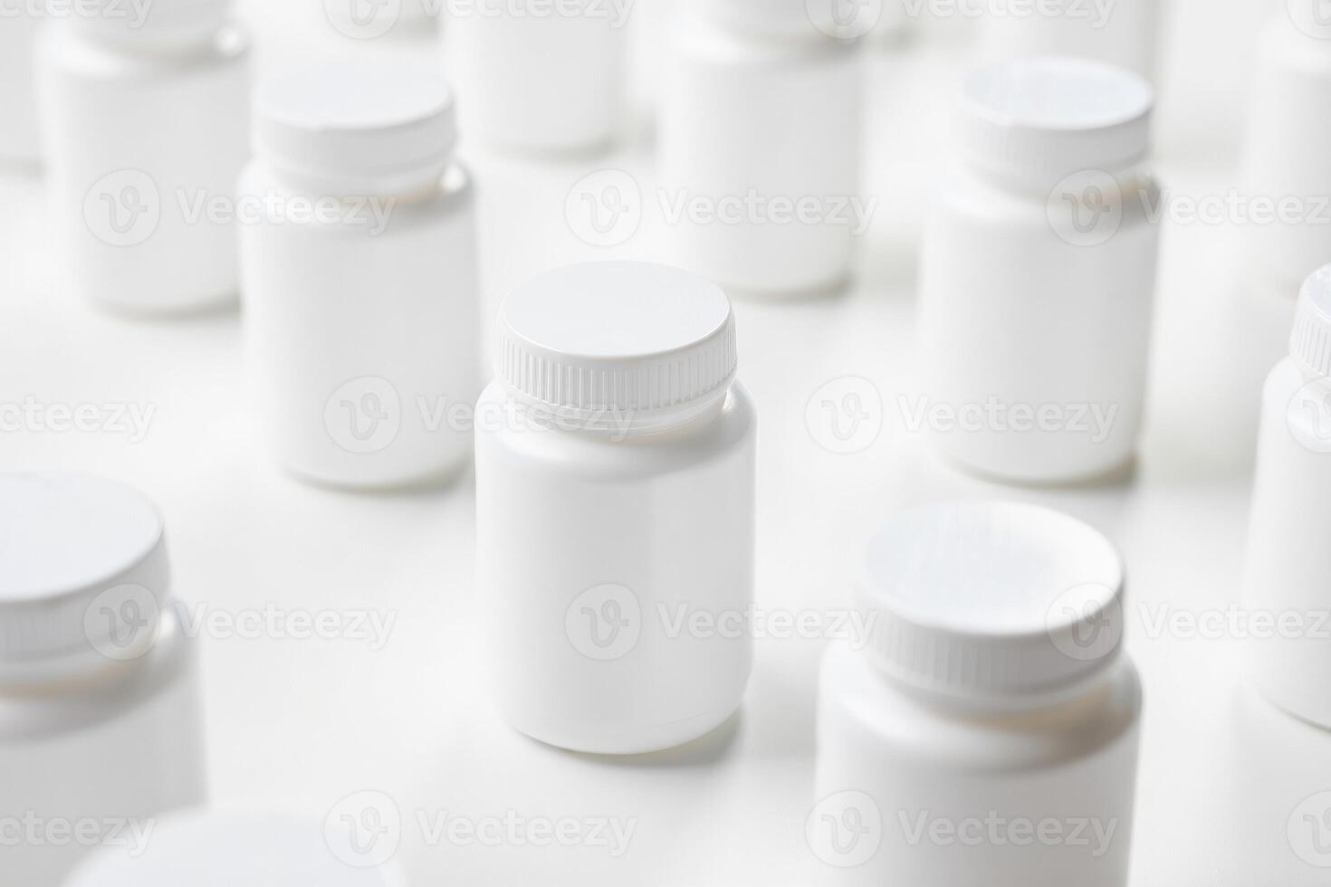 Many white plastic bottles are arranged in a row photo
