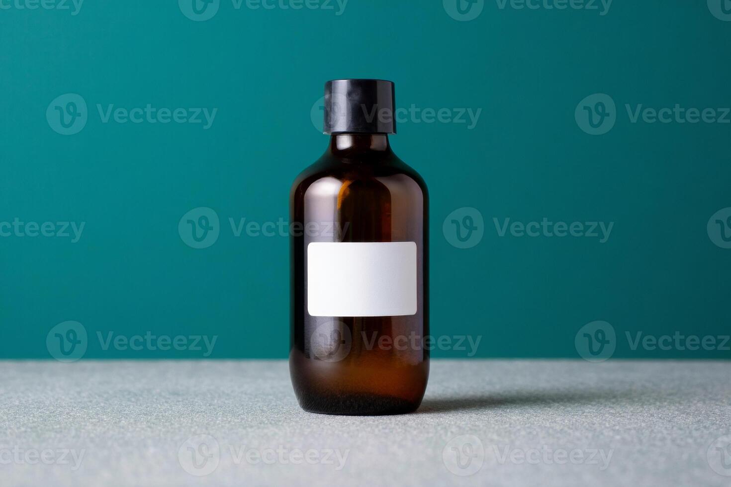 A brown bottle with a white label on a table photo