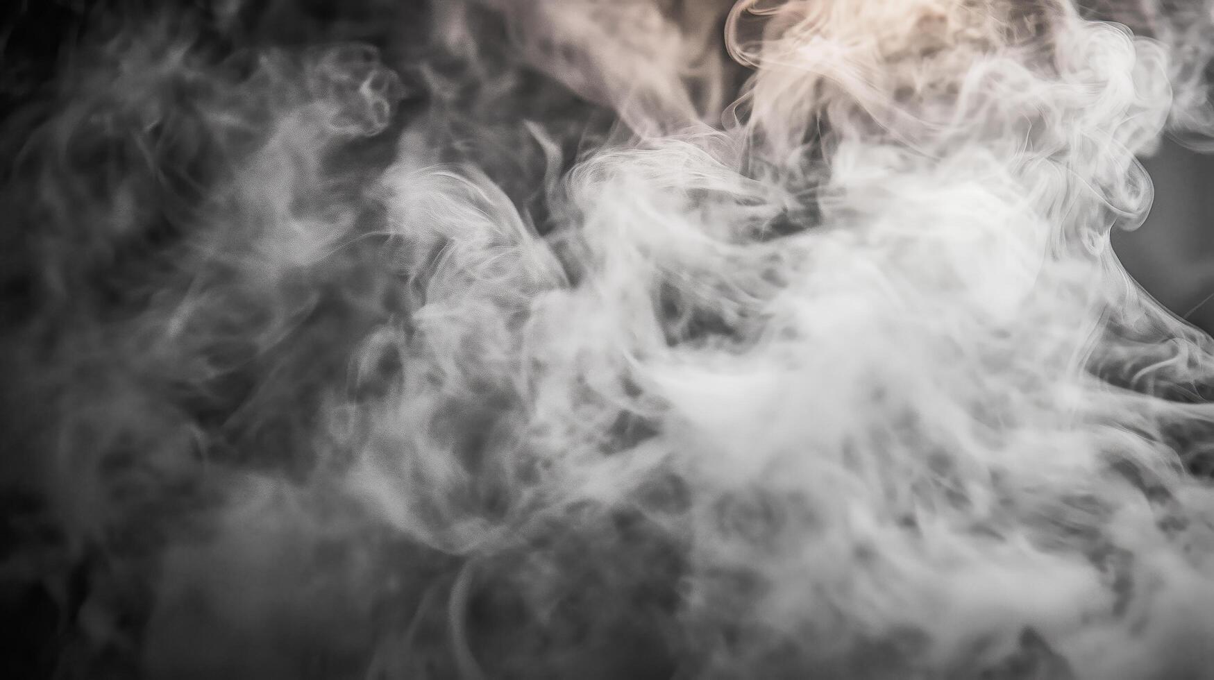 white smoke on dark background. photo