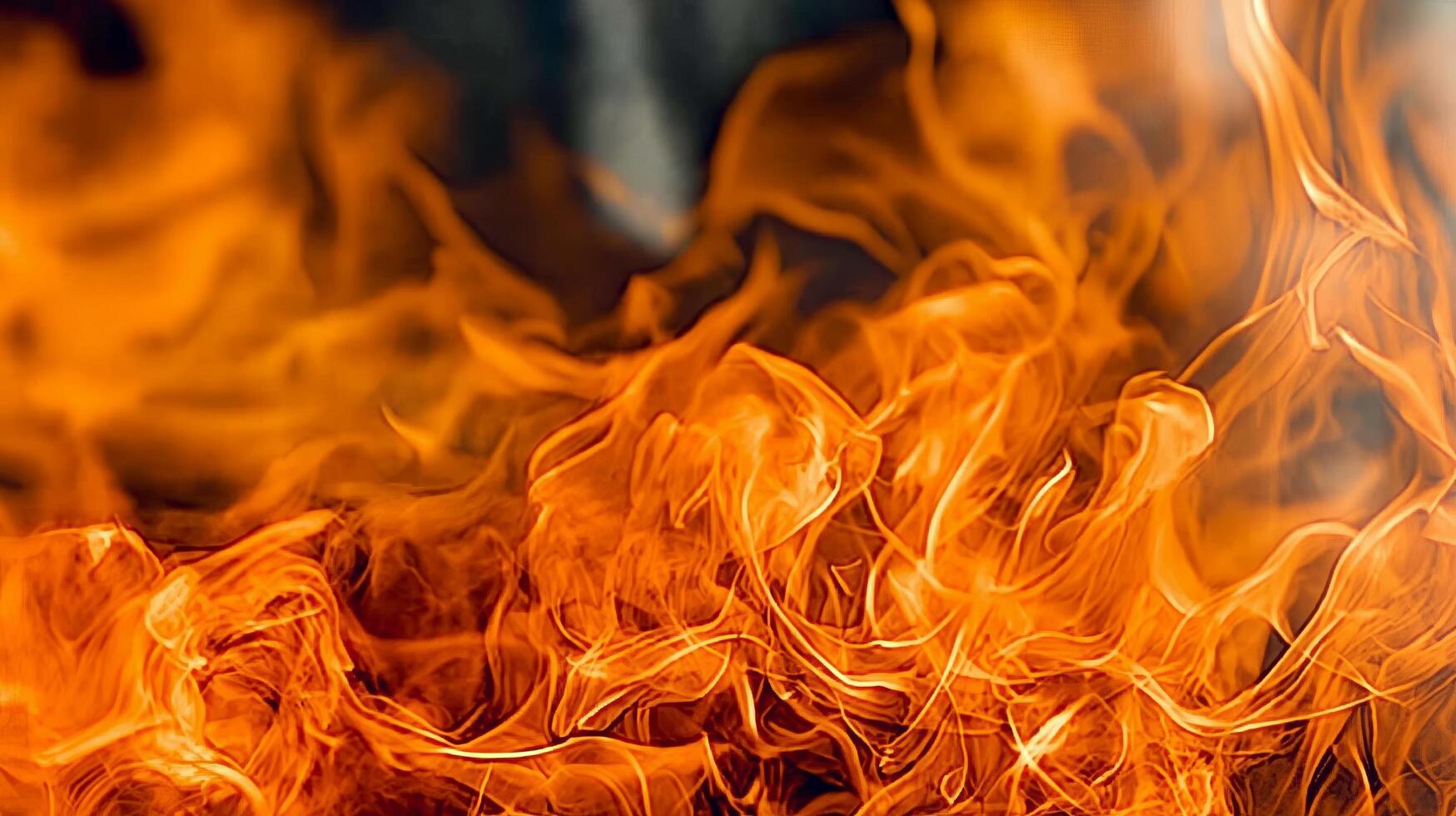 Intense closeup of bright orange flames in motion photo