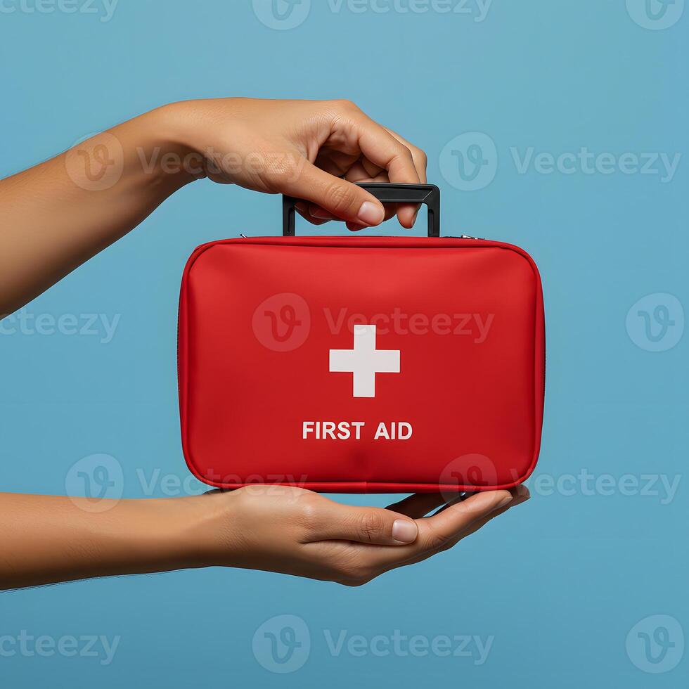 A person holding a first aid kit in their hand photo