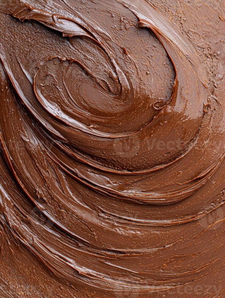 Close up of rich, smooth chocolate frosting photo