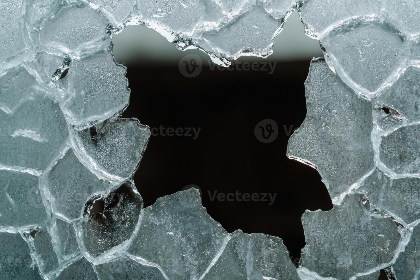 Broken glass with a hole in the middle photo
