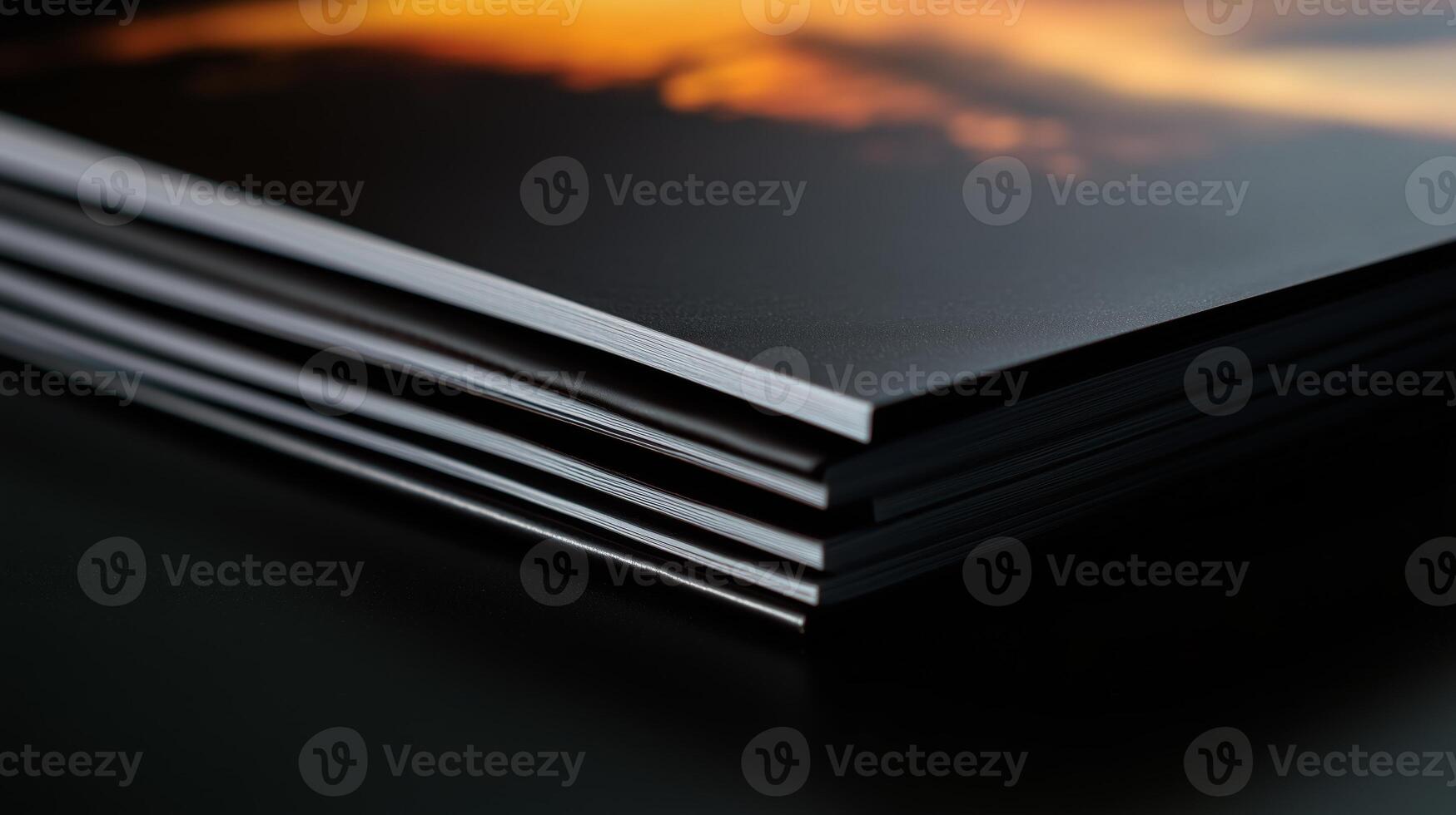 A stack of books with a photo of a sunset