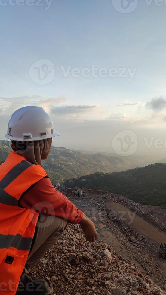 A person wearing a hard hat photo