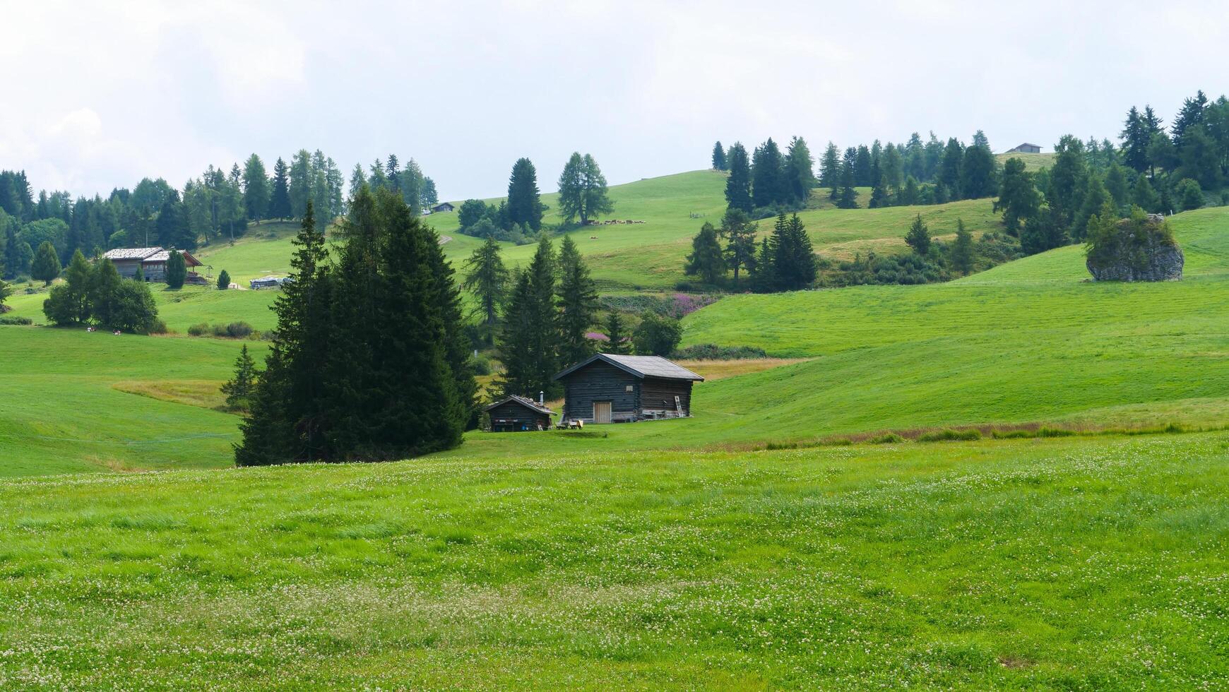 Serene countryside retreat nestled among lush green hills and gentle slopes in a tranquil rural setting photo