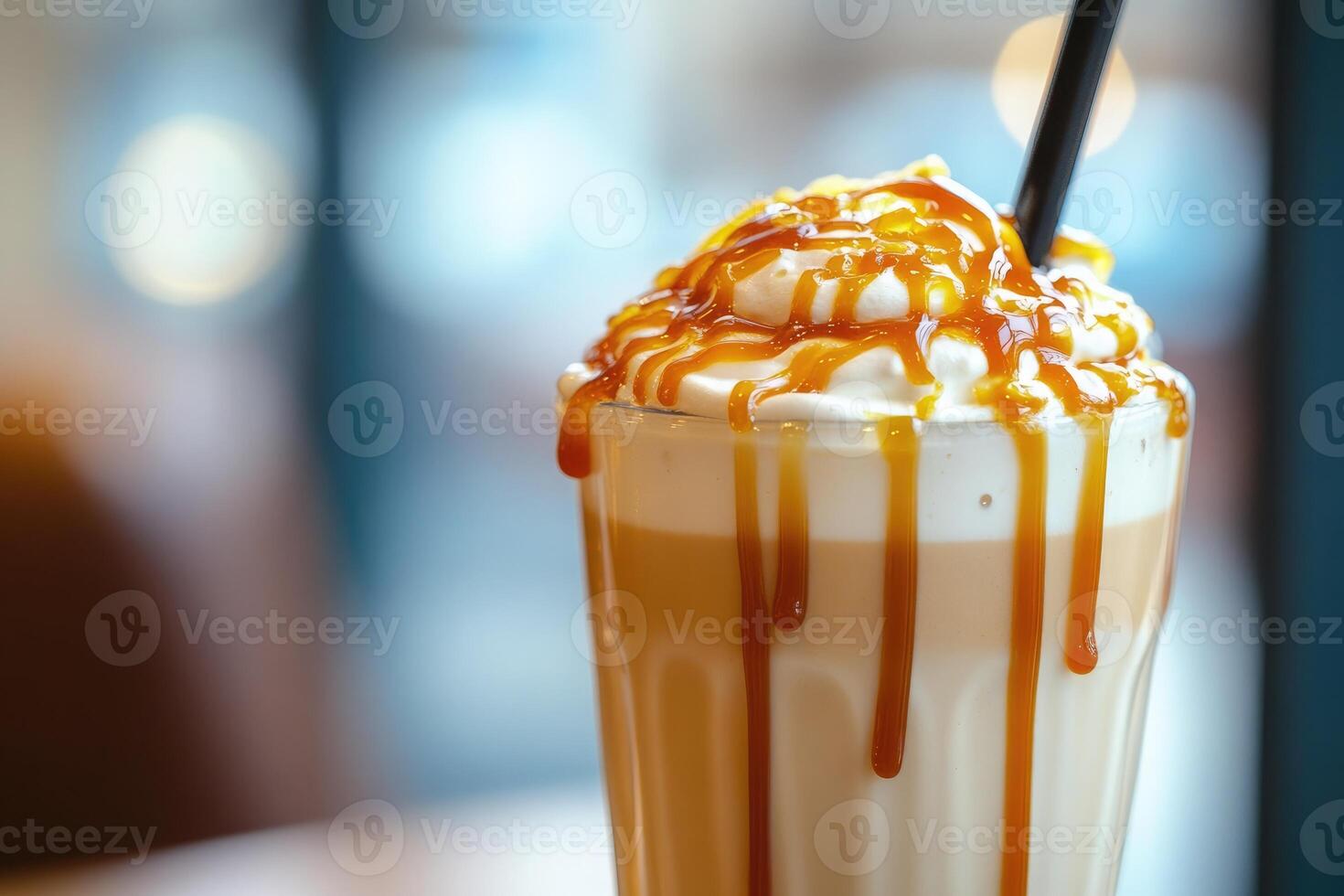 A caramel latte with whipped cream and caramel drizzle photo