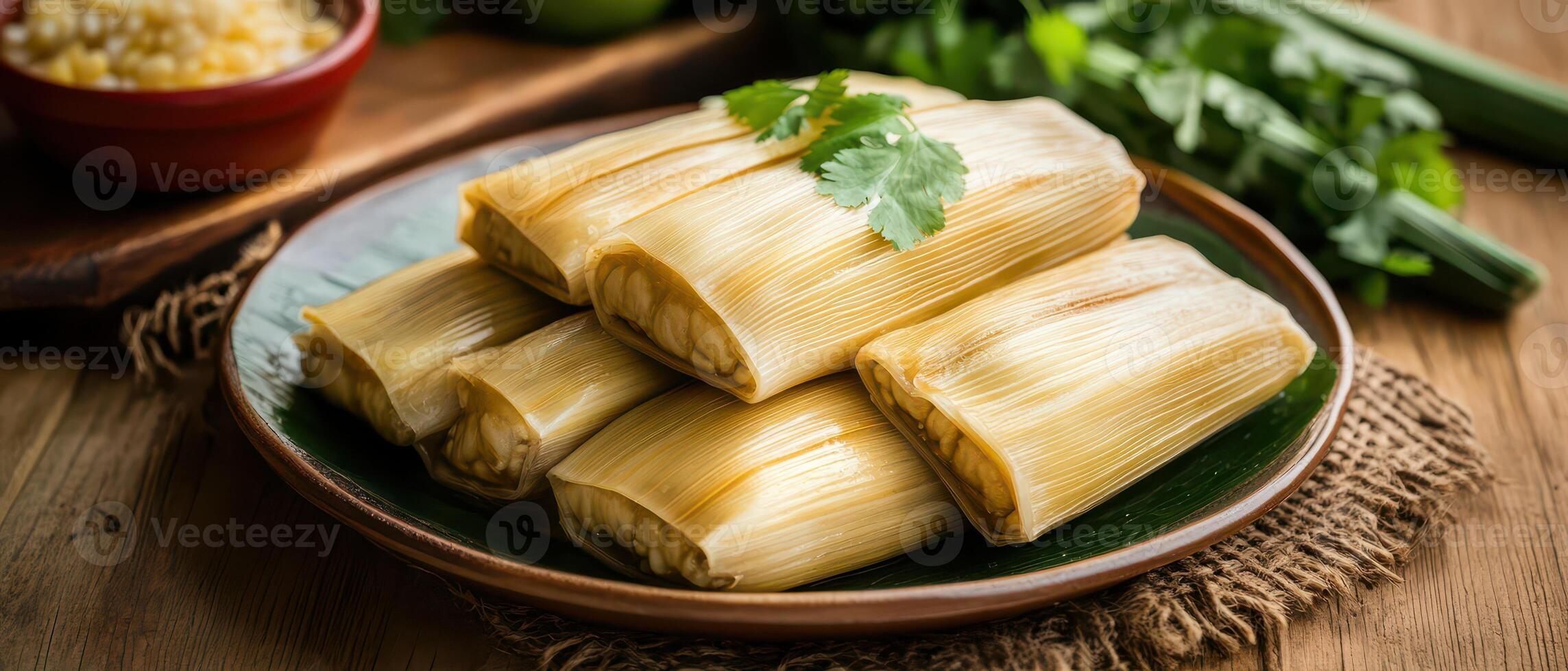 Delicious tamales served on a rustic plate photo