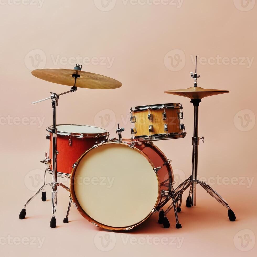 Classic drum set on a soft pink background photo