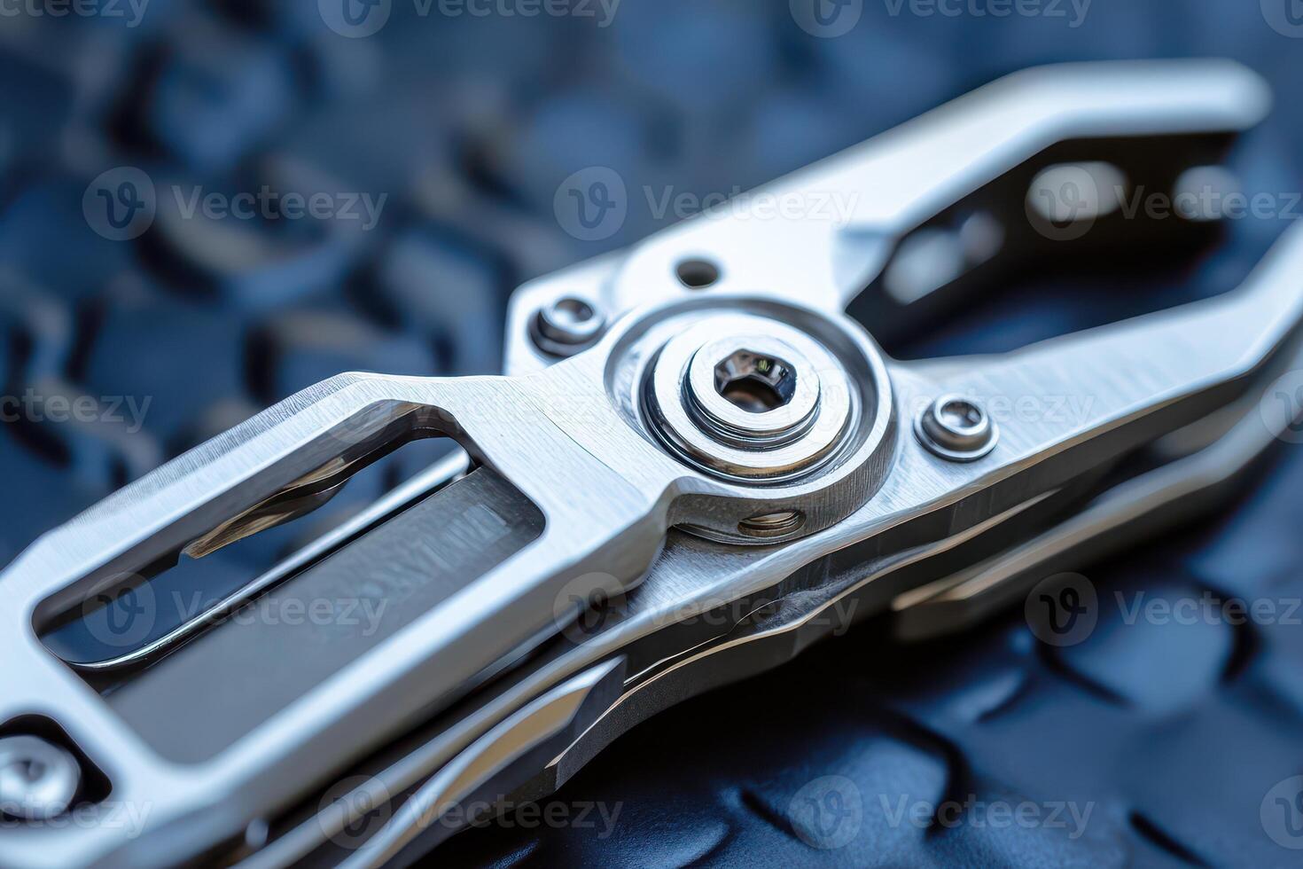 Shiny multi tool on textured backdrop photo
