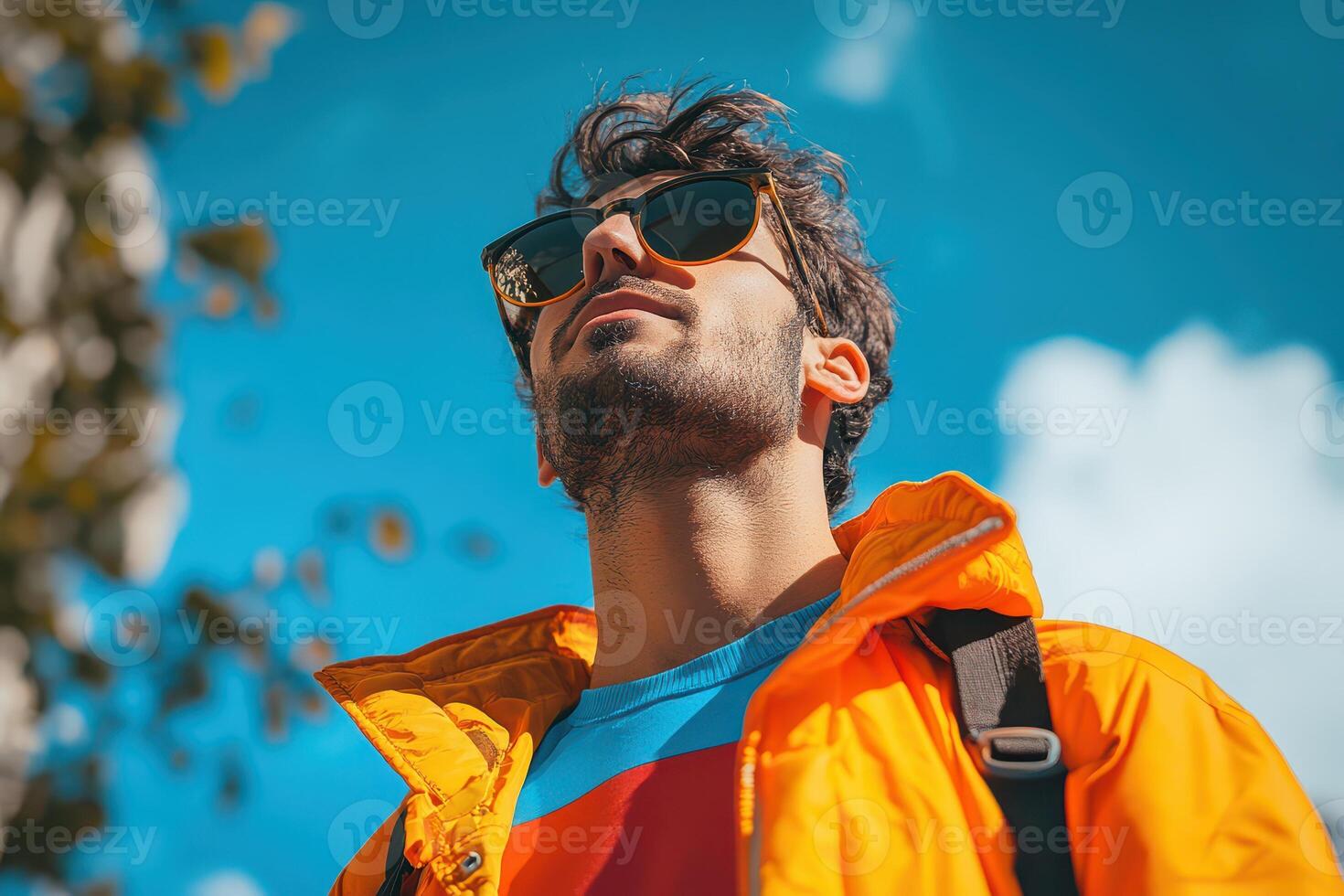 Bright sunny day with a smiling young man outdoors photo