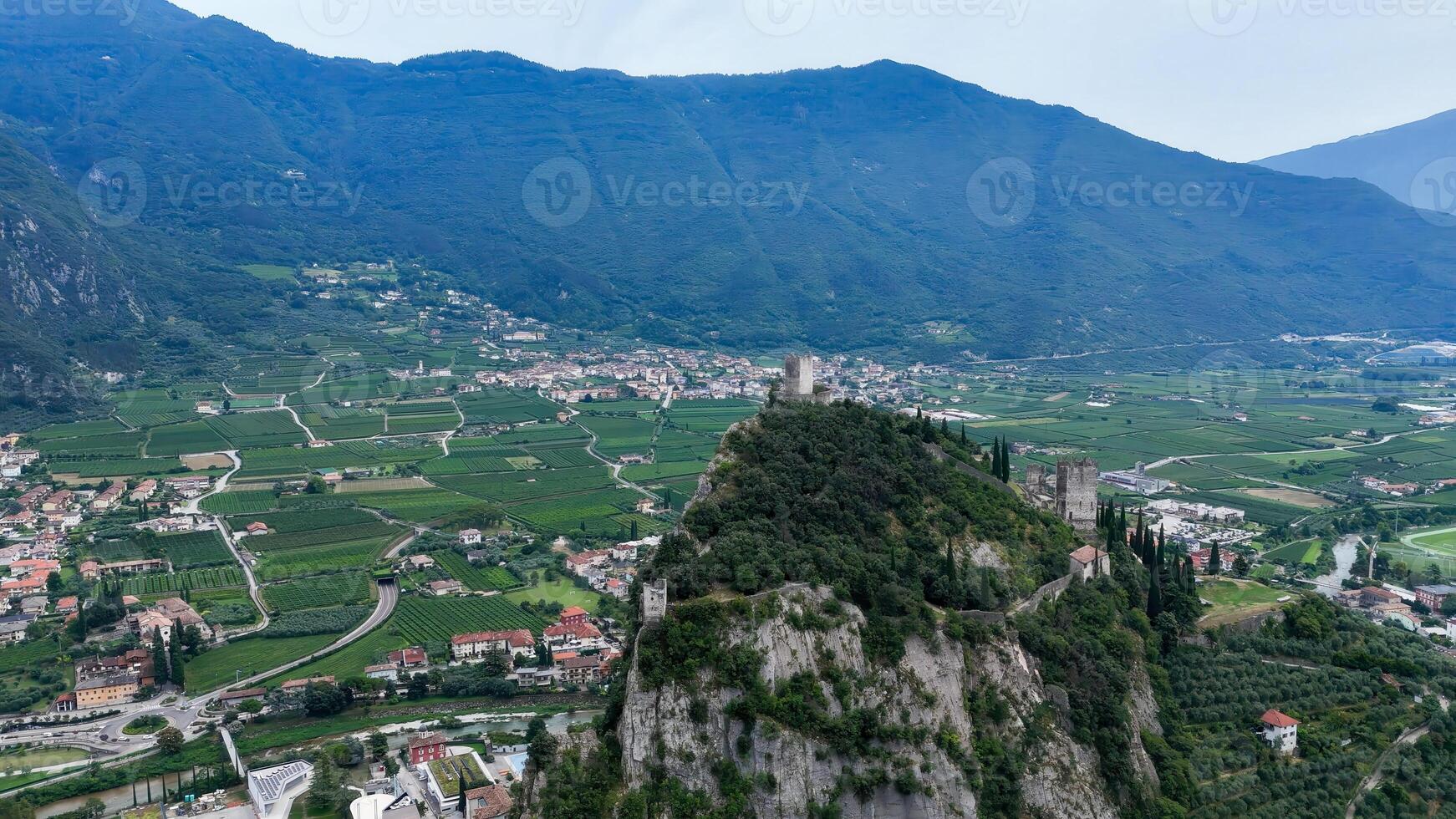 Exploring ancient castles atop hills overlooking lush vineyards in a picturesque valley at twilight photo