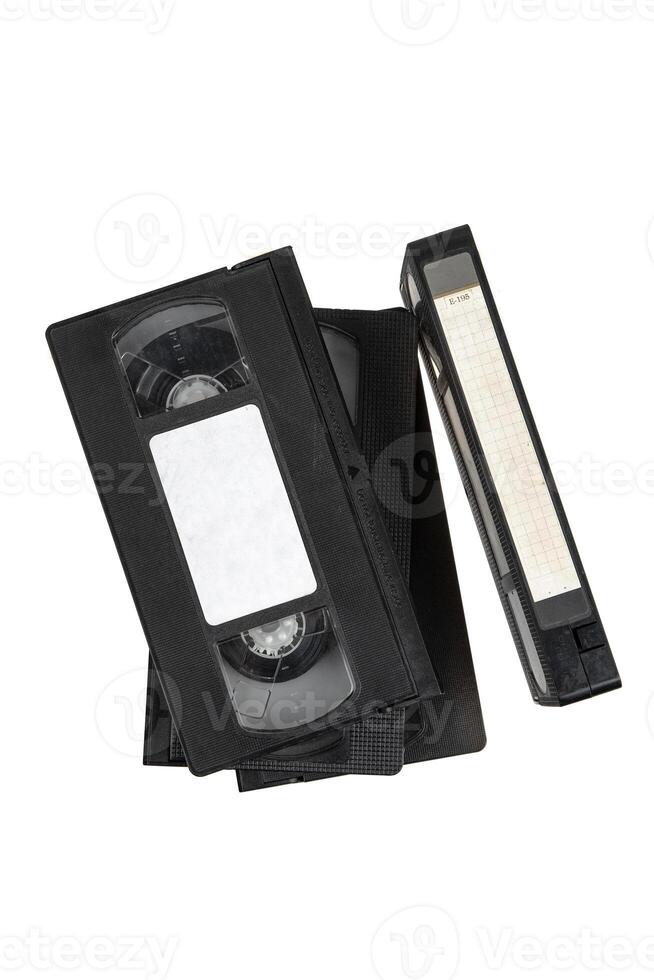 A stack of vintage black VHS tapes arranged together, showcasing a nostalgic piece of media history. photo